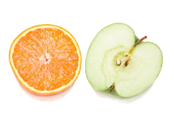 Halves of orange and green apple — Stock Photo, Image