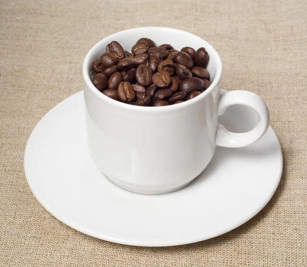 Coffee beans in white cup — Stock Photo, Image
