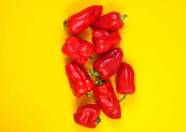 Peppers on yellow backgownd — Stock Photo, Image