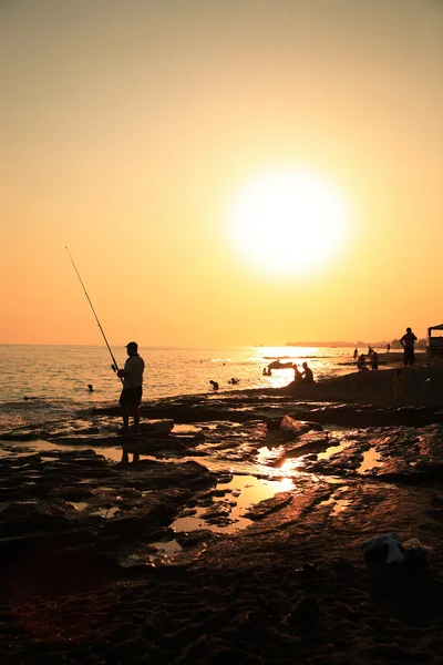 Pescador na praia — Fotografia de Stock