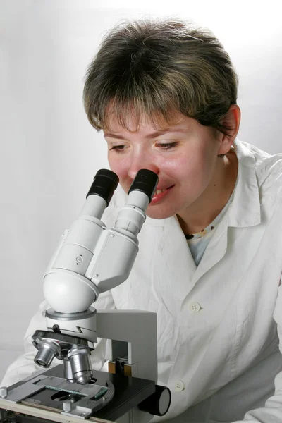 Scientist and microscope — Stock Photo, Image
