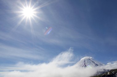 Kluchevskoy volcano and sun clipart