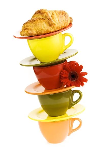 Color cups and fresh croissant — Stock Photo, Image