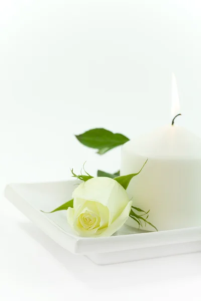 Yellow rose and candle — Stock Photo, Image