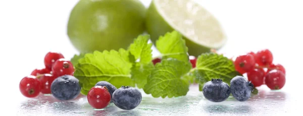 Fresh berries with mint and lime — Stock Photo, Image