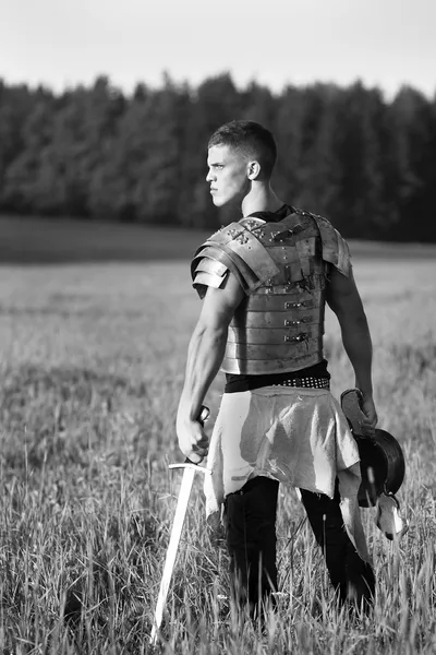 One Roman soldier in field. — Stock Photo, Image