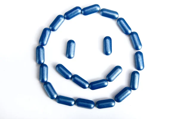 A pílula constitui um rosto sorridente — Fotografia de Stock