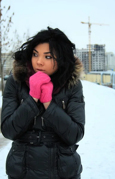 Attractive young girl in pink gloves — Stock Photo, Image