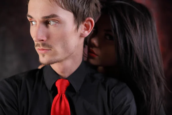Man with red tie and girl with red lips
