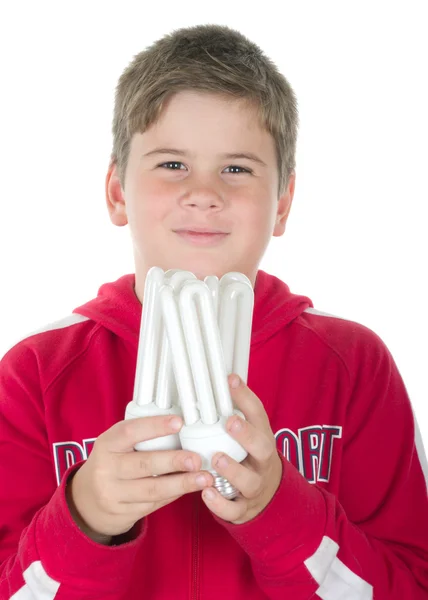 Chlapec drží žárovku — Stock fotografie