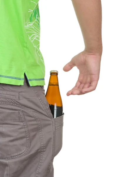 Bottle with a drink lies in a pocket — Stock Photo, Image