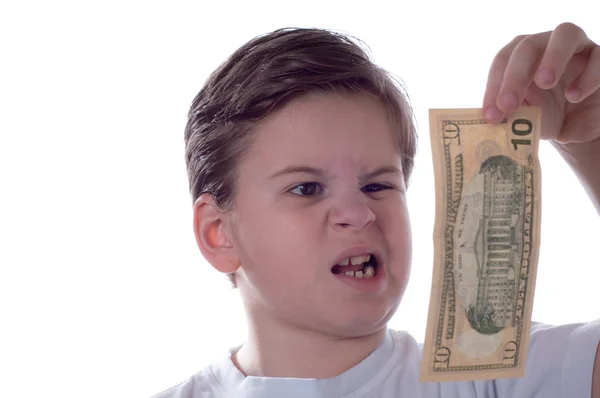 Boy looks at money — Stock Photo, Image