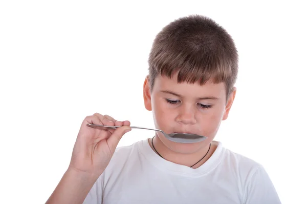 Niño con una cuchara —  Fotos de Stock