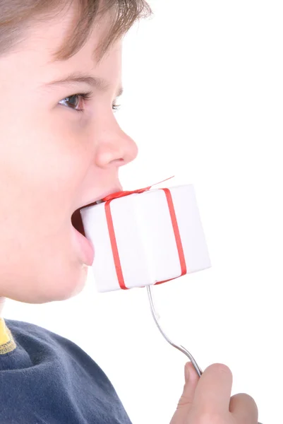 Boy bites a gift on a plug — Stock Photo, Image