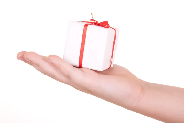 Box with gift in palm — Stock Photo, Image