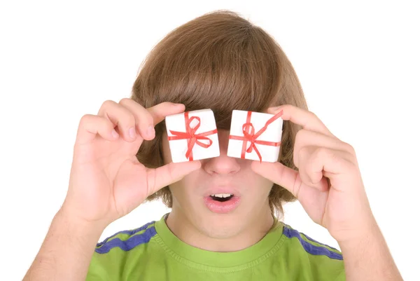 Teenager holds gifts before eyes — Stock Photo, Image