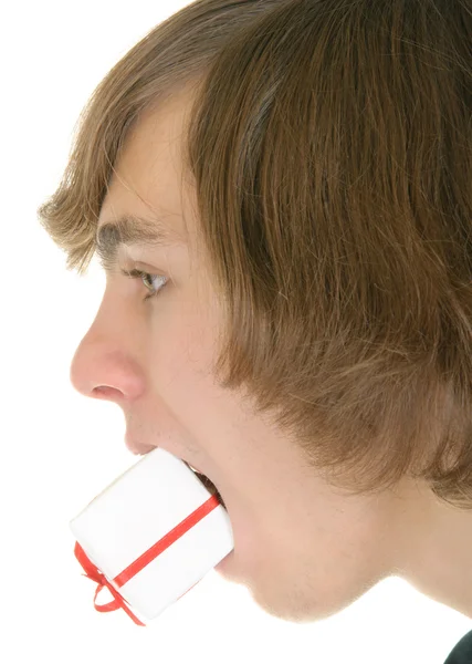 Gift in mouth at teenager — Stock Photo, Image