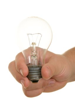 Hand holds incandescent lamp clipart