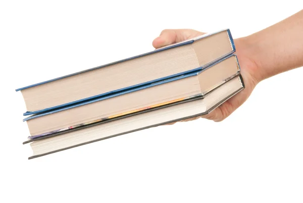 Hand houdt drie boeken — Stockfoto