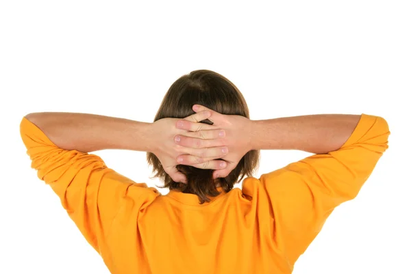 Adolescente segura as mãos atrás da cabeça — Fotografia de Stock