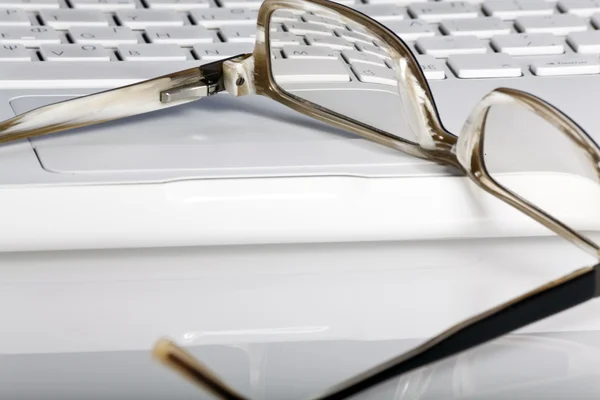 stock image White laptop and glasses