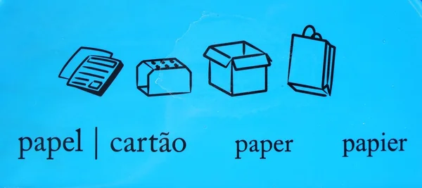 Paper recycle symbols in different langu — Stock Photo, Image