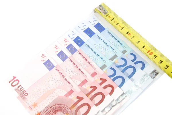 Måttband och euron räkningar — Stockfoto