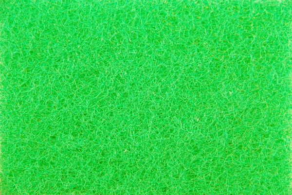 Green kitchen sponge (background) — Stock Photo, Image