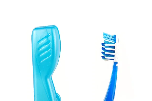 Escova de dentes azul e branco e caso — Fotografia de Stock