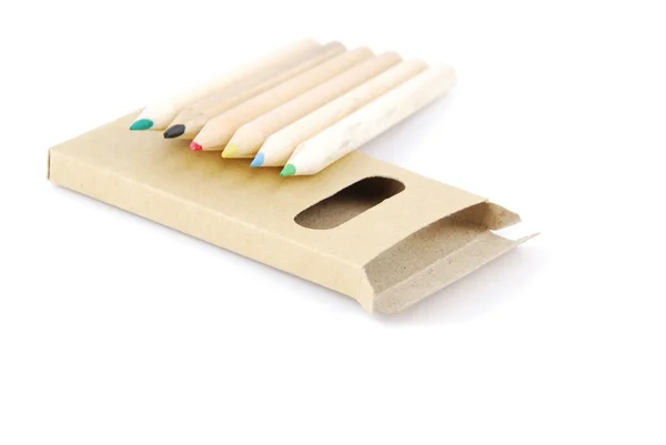 Кольорові олівці та футляр для олівців на білому — стокове фото