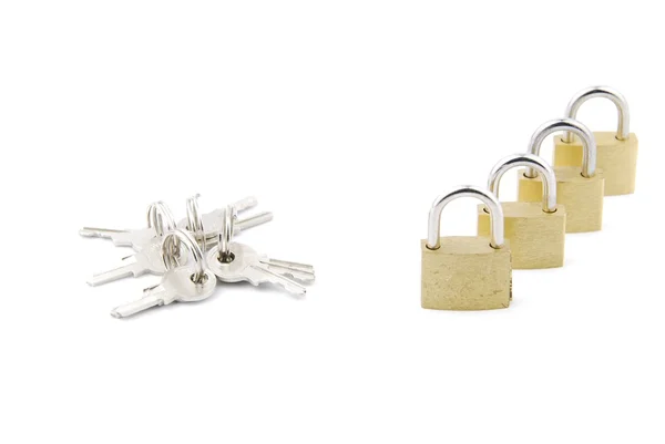 Golden closed padlocks with keys — Stock Photo, Image