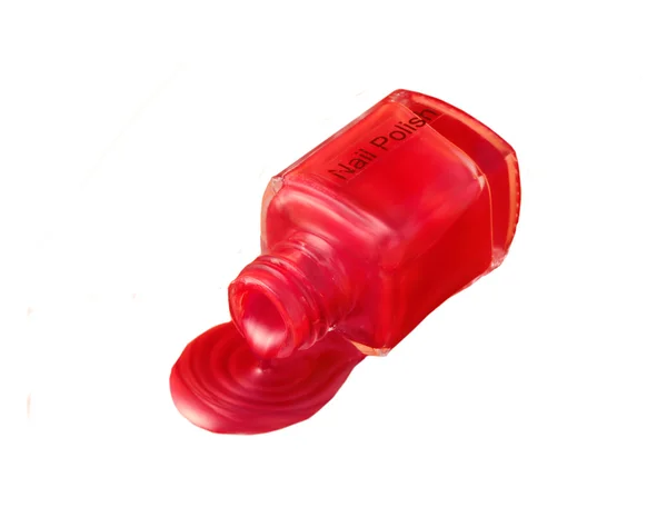 Derrame de esmalte de uñas metálico rojo —  Fotos de Stock