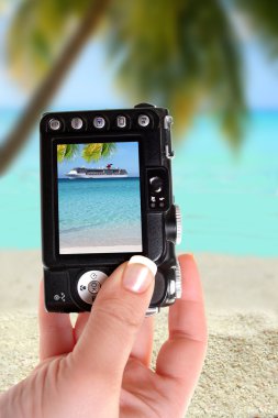 Taking picture ofl ship and beach clipart