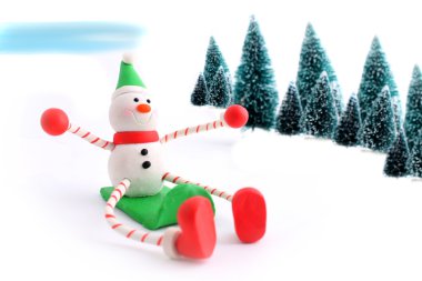 Sledding snowman clipart