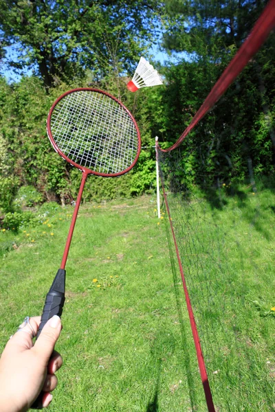 Playing badminton outdoors — Stock Photo, Image