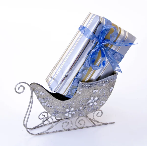 Gift box in sledge — Stock Photo, Image