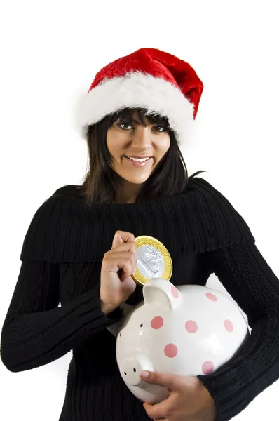 Teen Girl Santa with pig coin box Royalty Free Stock Photos