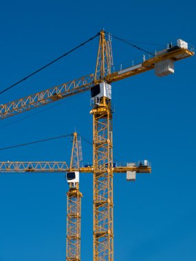 Cranes building two clipart