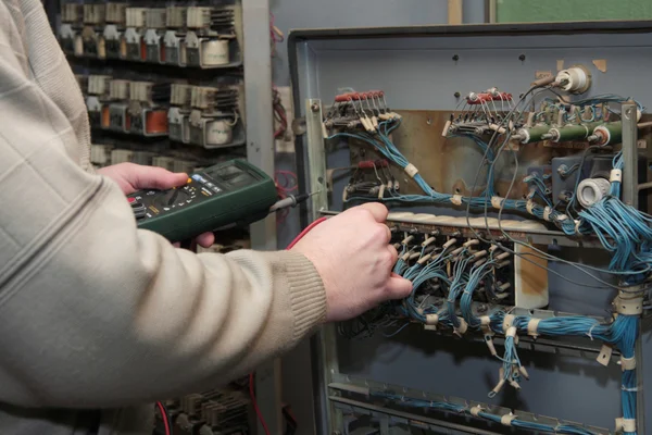 stock image Electrician checking circuit