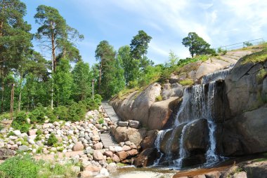 Waterfall and stairs in the Park Sapokka clipart