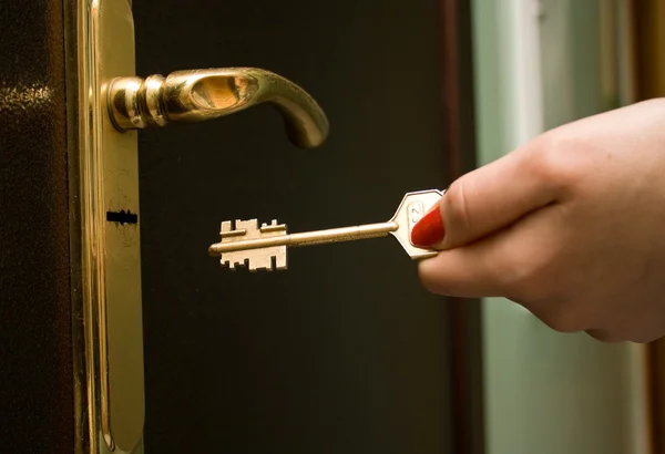 stock image Hand, locking a key an iron door 2