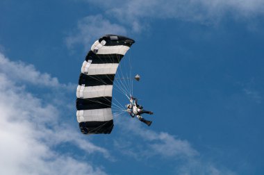 Parachutist in filght clipart