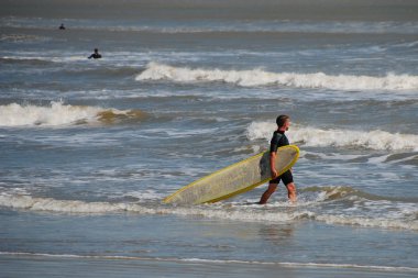 Surfer in Galveston, Texas, 2008 clipart