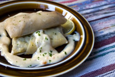 Cabbage rolls with white sauce clipart