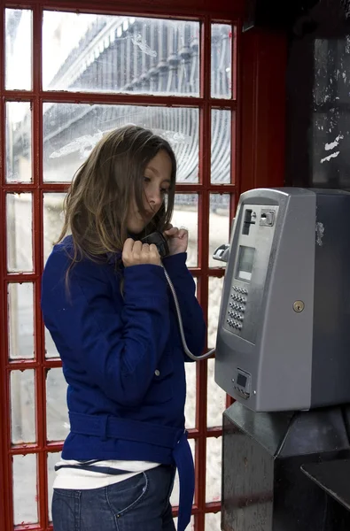 stock image Person talking public phone