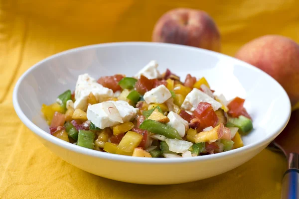Peach salad with feta & tomato — Stock Photo, Image