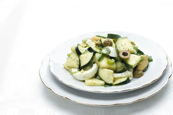 Zucchini salad with egg and olives — Stock Photo, Image