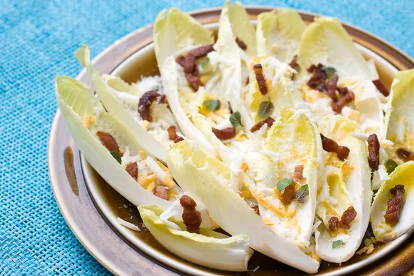 Chicory salad with bacon — Stock Photo, Image