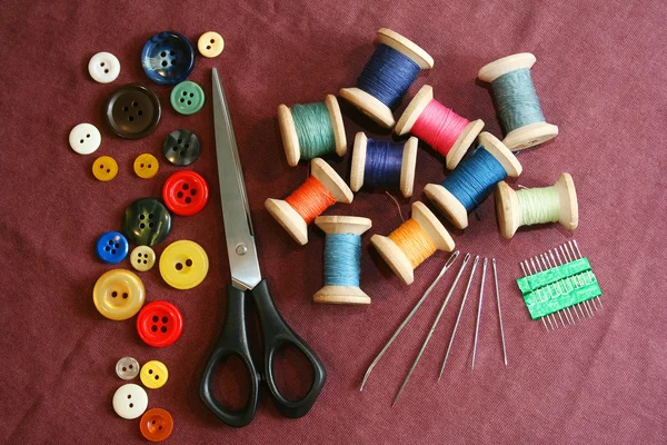 Sewing kit on a cotton cloth — Stock Photo, Image