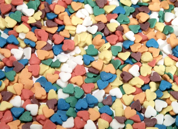 Fundo de doces coloridos na forma de — Fotografia de Stock